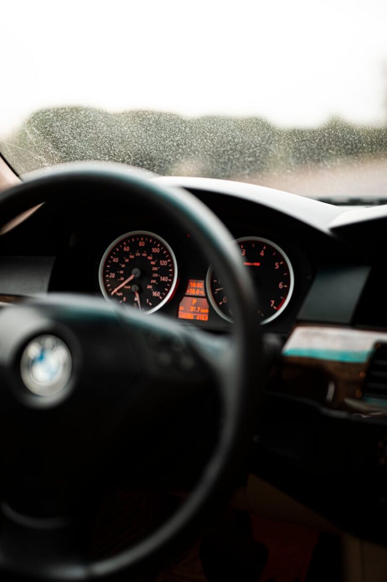 Close-up of a car's dashboard highlighting speedometer and odometer.
